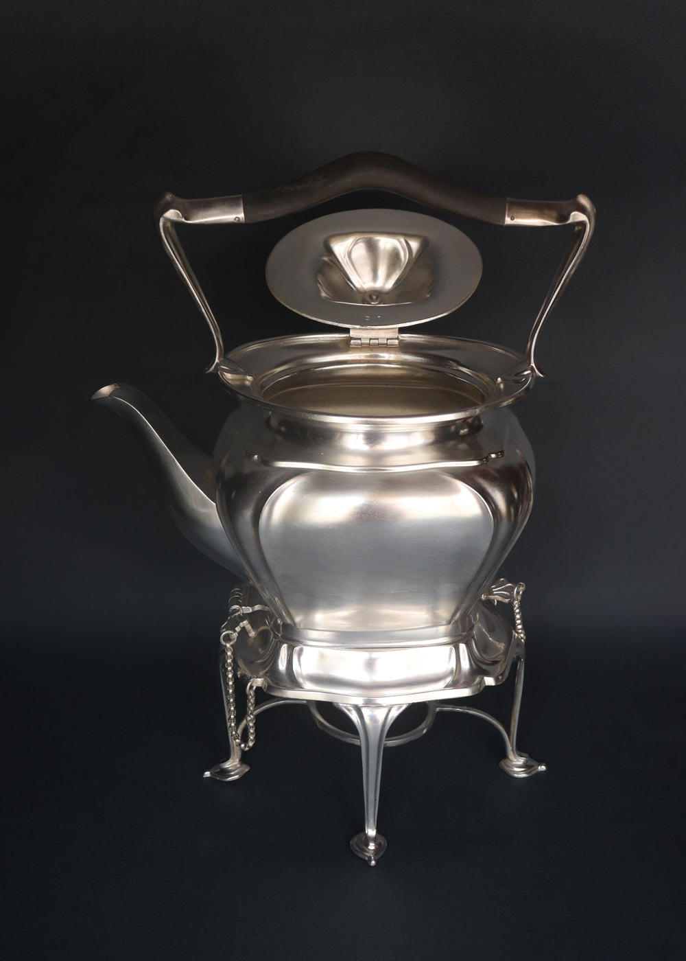 Antique Edwardian spirit kettle with its stand, burner and securing pins in superb condition. The kettle was made by Roberts & Belk in Sheffield with high-grade silver plate or” Regent Plate”, and the base has all the authenticating stamps including the registration number which was was officially issued by the British patient office in the year 1902, confirming that this kettle was made in England between 1902 and 1910.