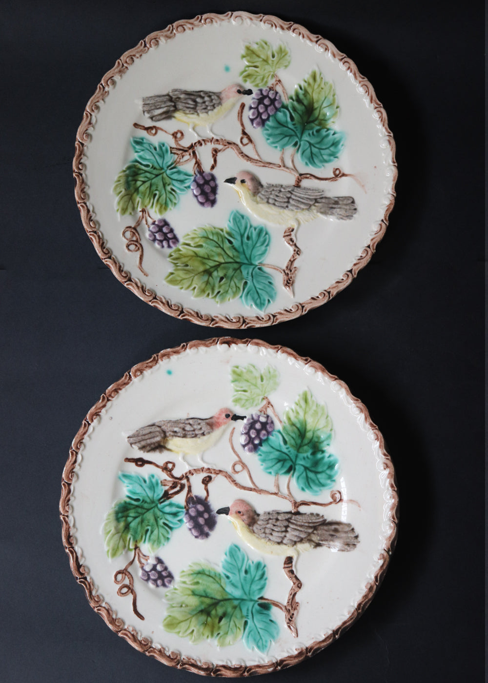 Two antique German Majolica plates of the “Birds & Grapes” design