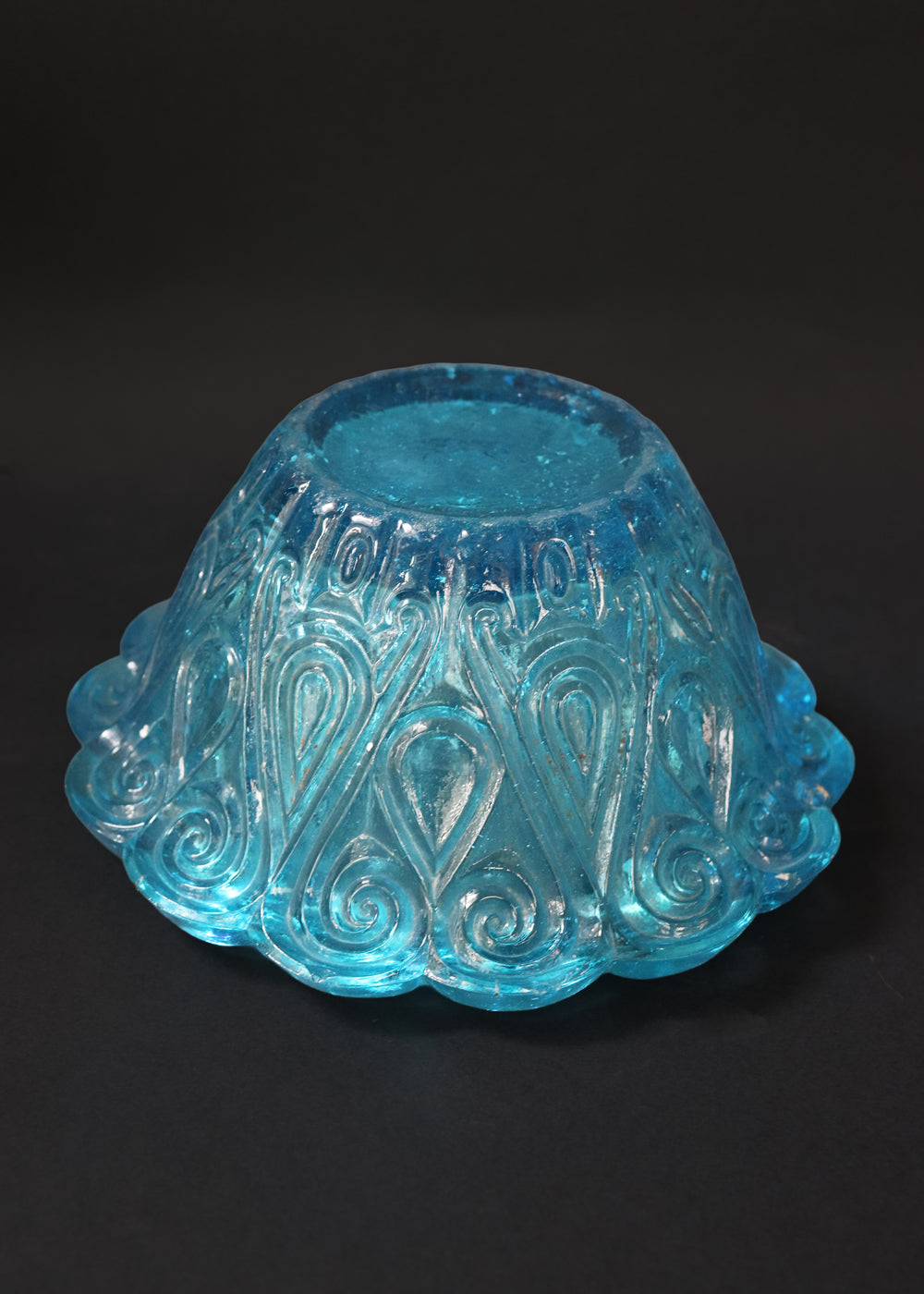 Antique moulded glass bowl in a beautiful turquoise colour and an incredible history