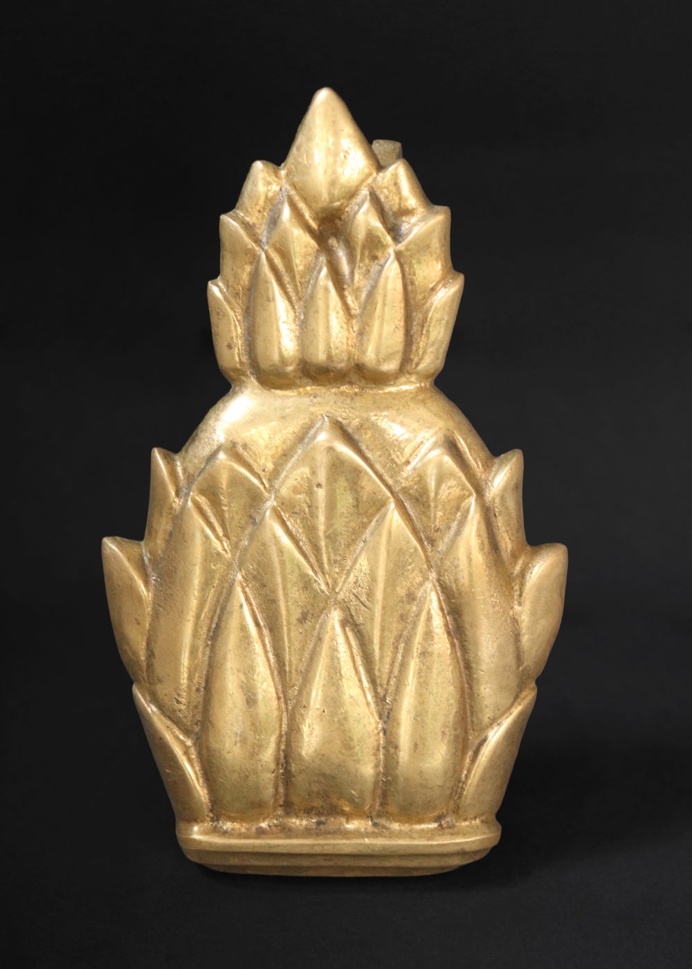 Vintage Newport brass door knocker. It is solid and heavy and was made by Virginia Metal crafters for their very popular Newport line. The pineapple knocker was especially beloved because the fruit is an enduring symbol of hospitality, wealth, and a safe return from sea voyages, a tradition with deep roots in Newport's maritime history. Made in the US, 1960s.