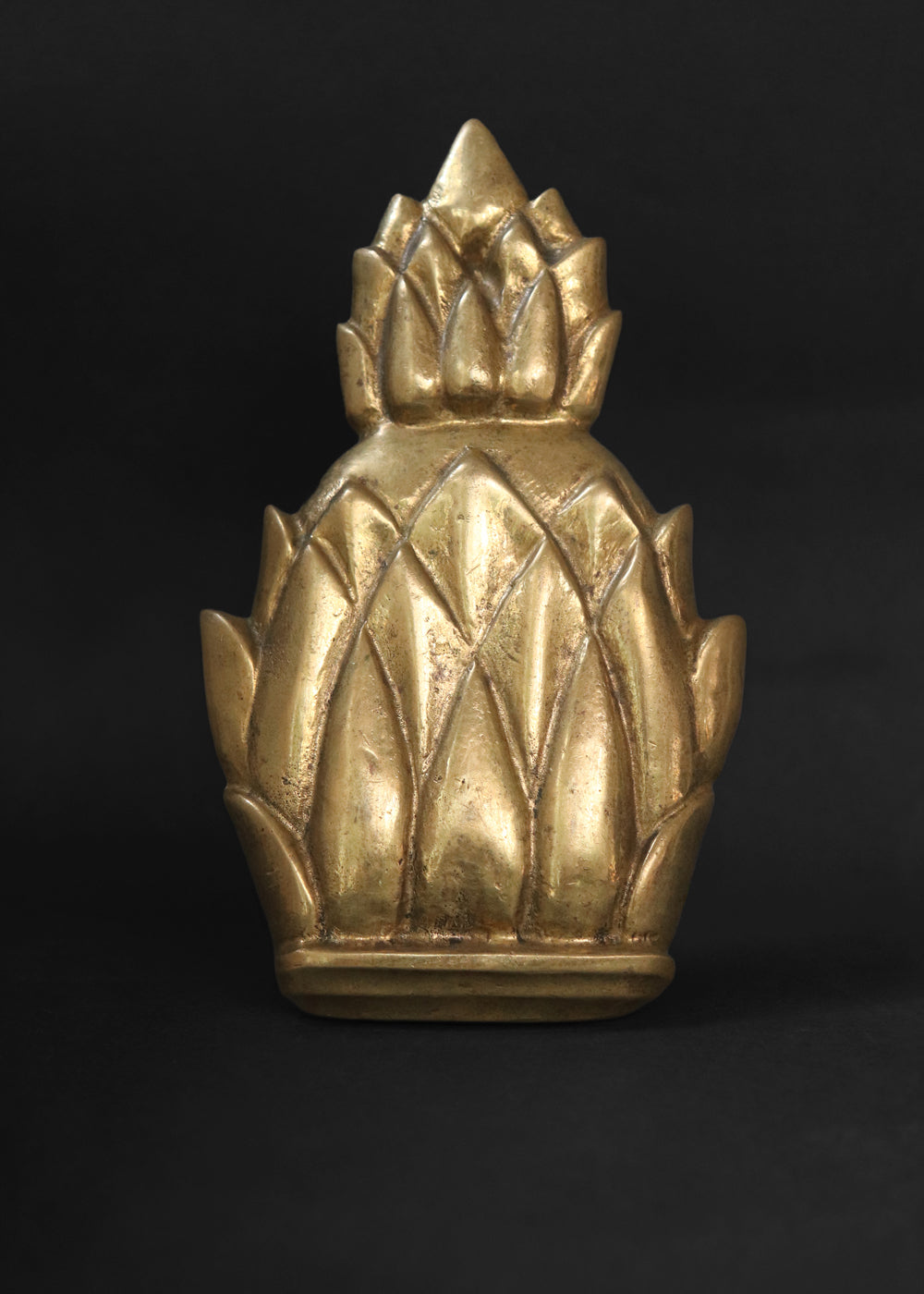 Vintage Newport brass door knocker. It is solid and heavy and was made by Virginia Metal crafters for their very popular Newport line. The pineapple knocker was especially beloved because the fruit is an enduring symbol of hospitality, wealth, and a safe return from sea voyages, a tradition with deep roots in Newport's maritime history. Made in the US, 1960s.