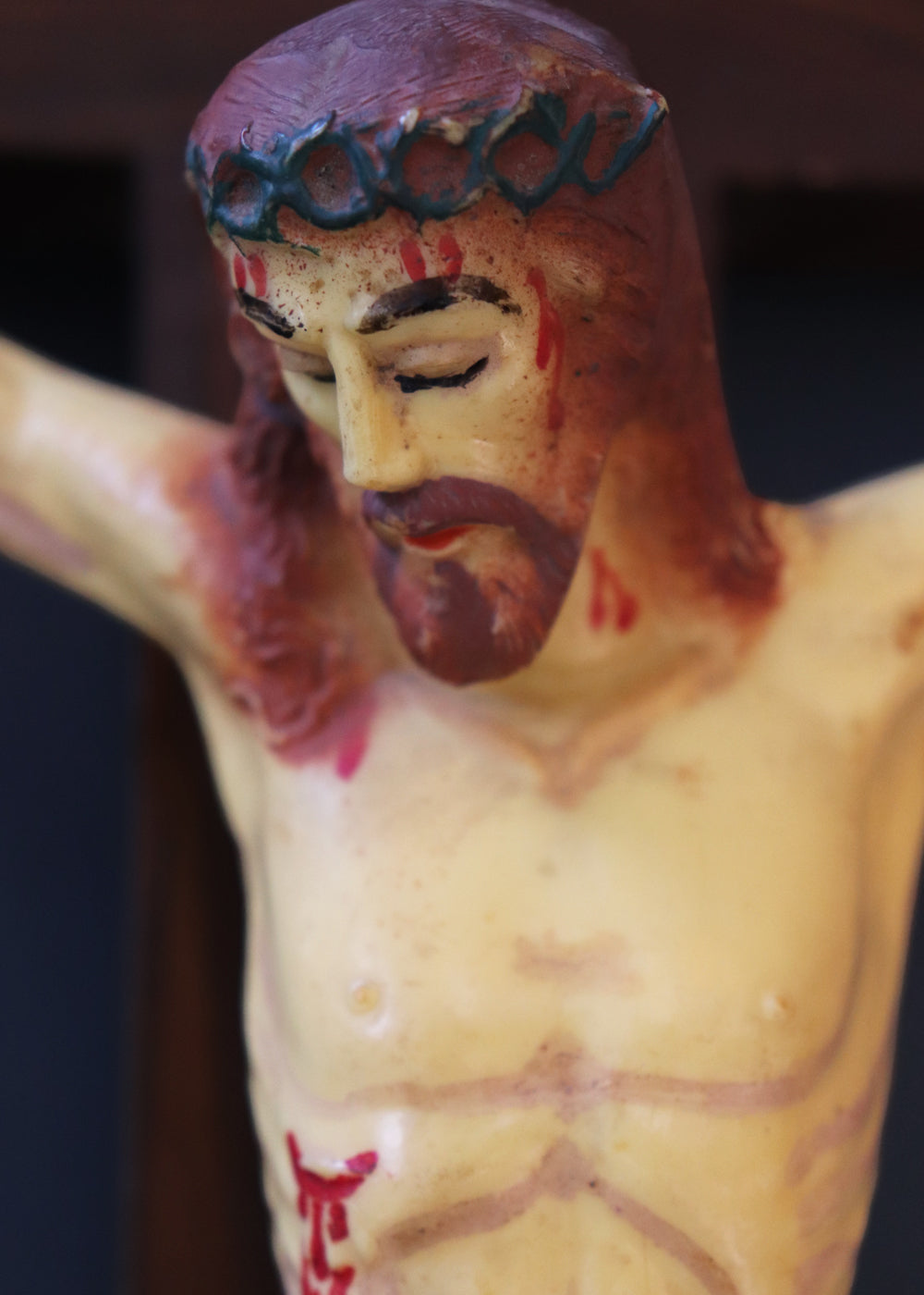 Vintage crucifix with Jesus probably made out of celluloid which is a form of early plastics. The moulded celluloid has been painted with details and the cross carries the traditional INRI plaque at the top. These lighter pieces were made to be a part of home altars, and should be from between the 1950s-1920s, India.