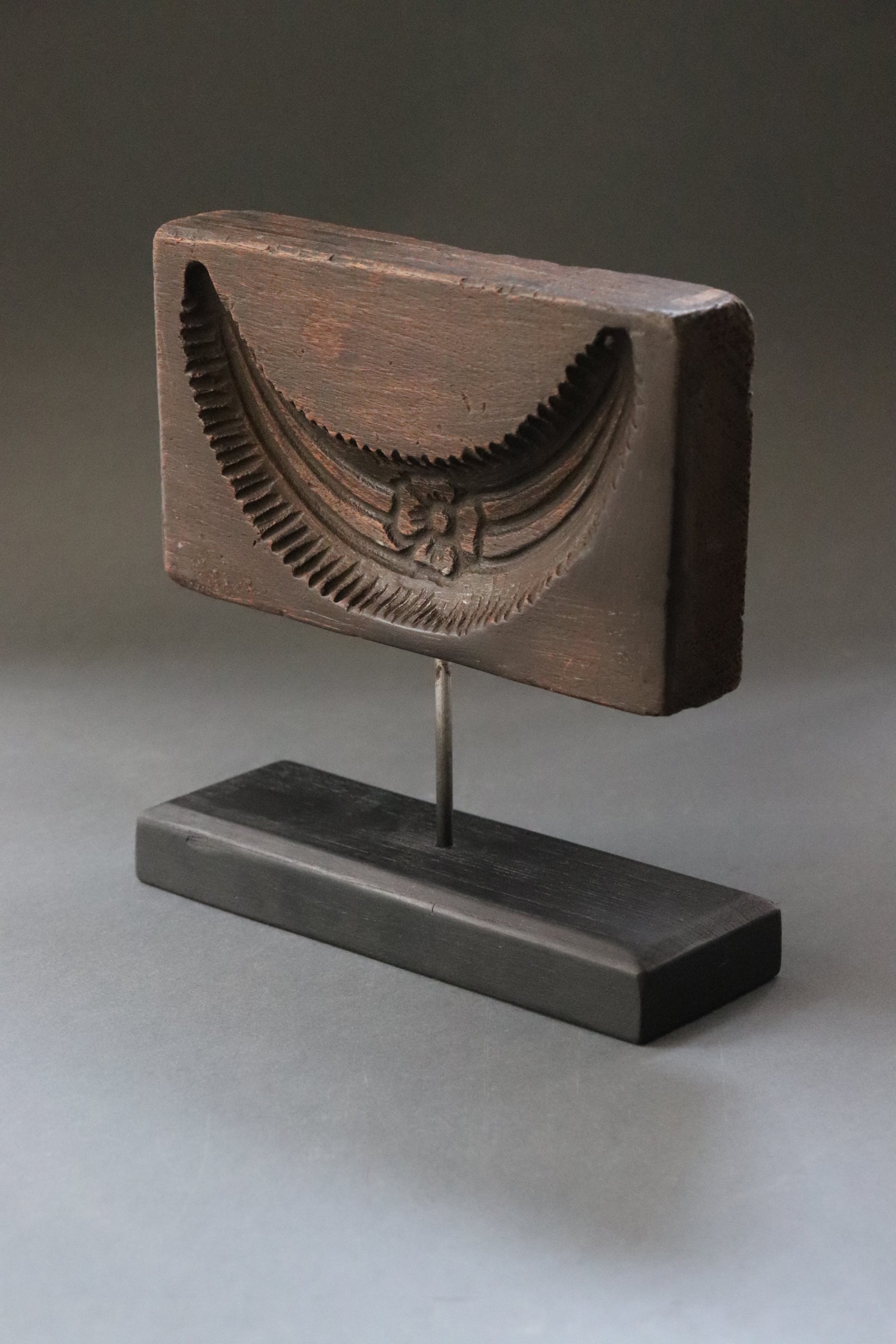 Plaque with deep relief of Shiva’s crescent moon carved in jackfruit tree wood. The crescent worn by Lord Shiva the moon in its fifth day phase and symbolizes the cycle of time through which the process of creation evolves, the beginning till the end. From Kerela, should be early 1900s.