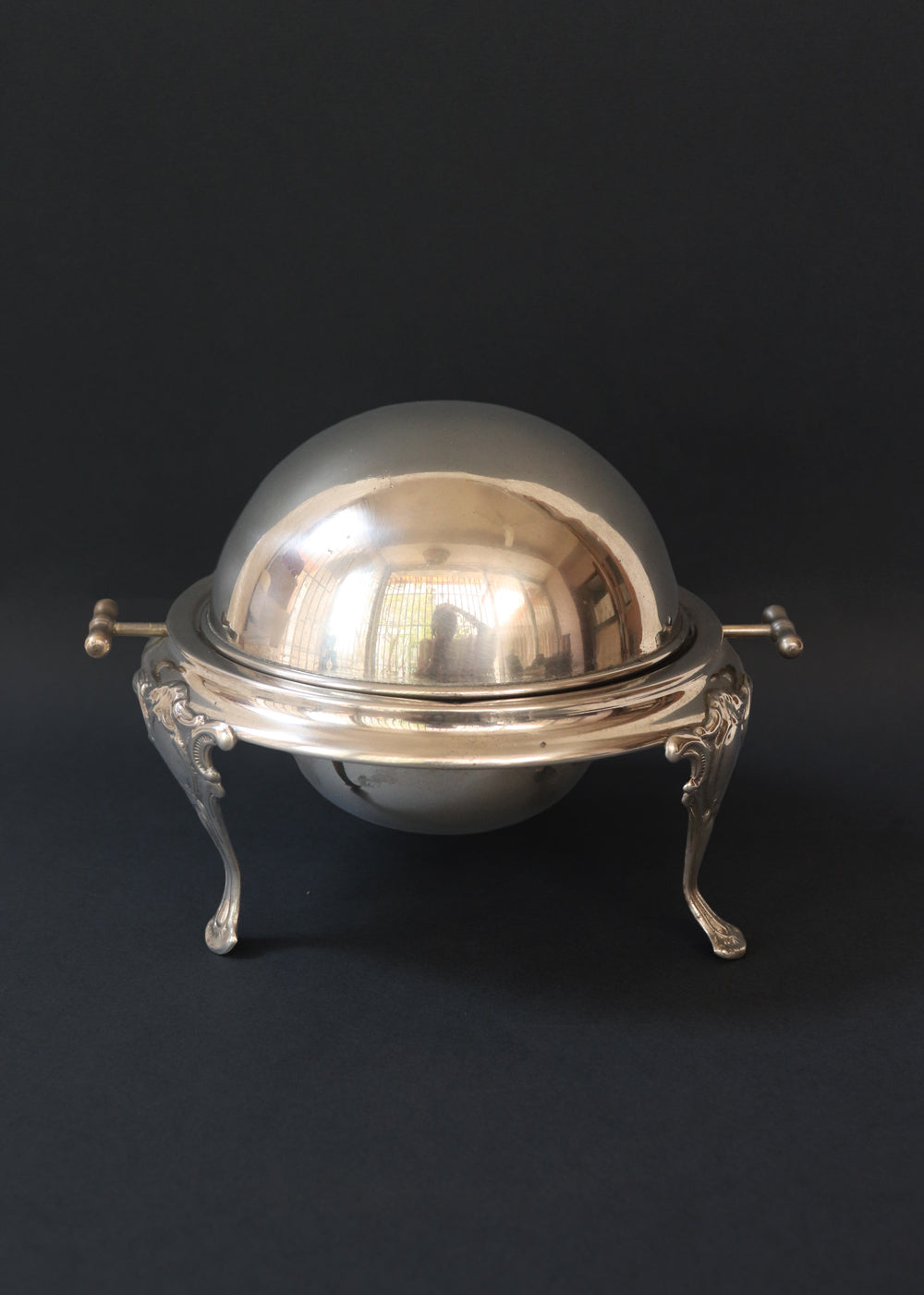 Vintage silver plated roll top caviar server or butter dish. It has a perfect dome top and clean lines and stands on 3 gorgeous feet decorated feet. Most likely mid 1900s, England.