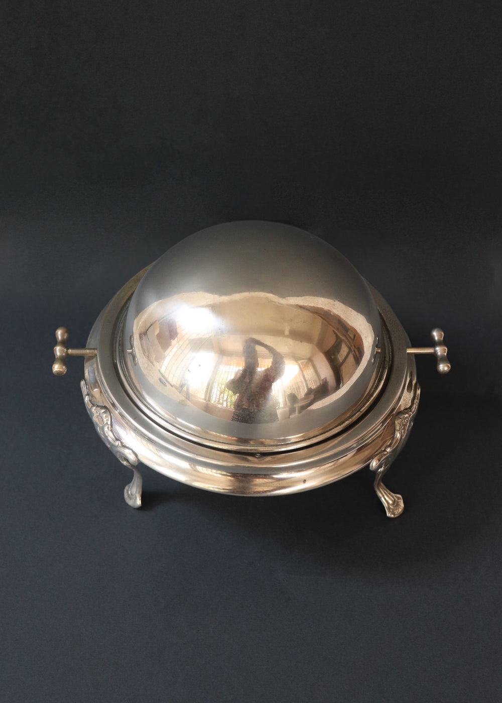 Vintage silver plated roll top caviar server or butter dish. It has a perfect dome top and clean lines and stands on 3 gorgeous feet decorated feet. Most likely mid 1900s, England.