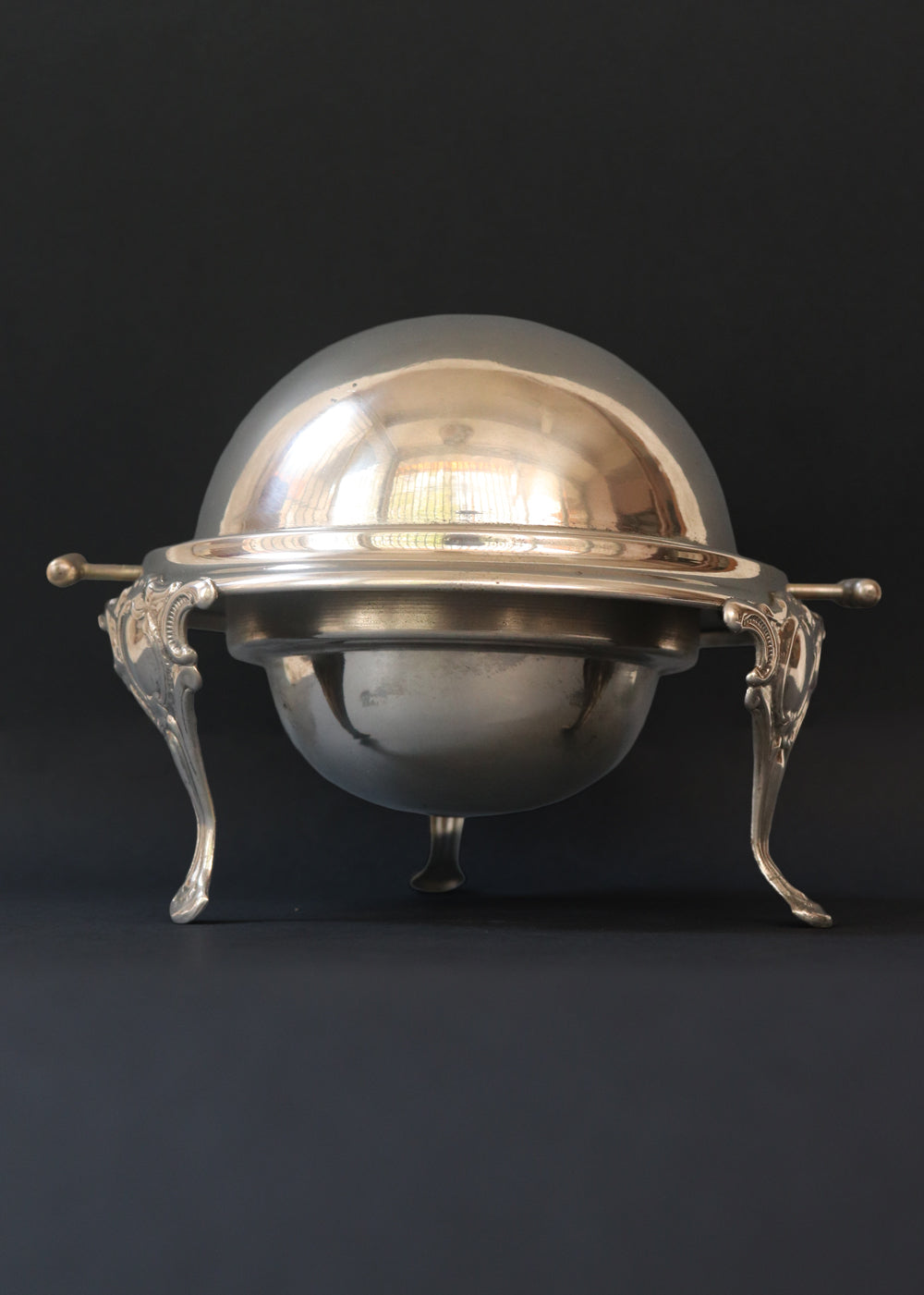 Vintage silver plated roll top caviar server or butter dish. It has a perfect dome top and clean lines and stands on 3 gorgeous feet decorated feet. Most likely mid 1900s, England.