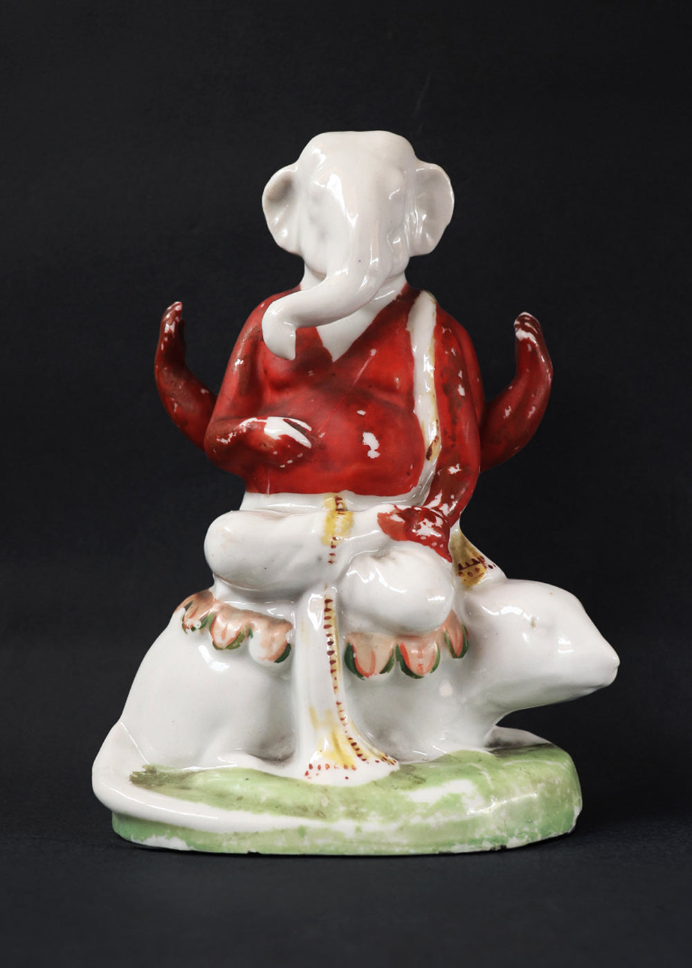 German made bisque porcelain slip cast figure of Ganesh made for colonial India in the early 1900s. These figures were inspired by paintings by Raja Ravi Varma.