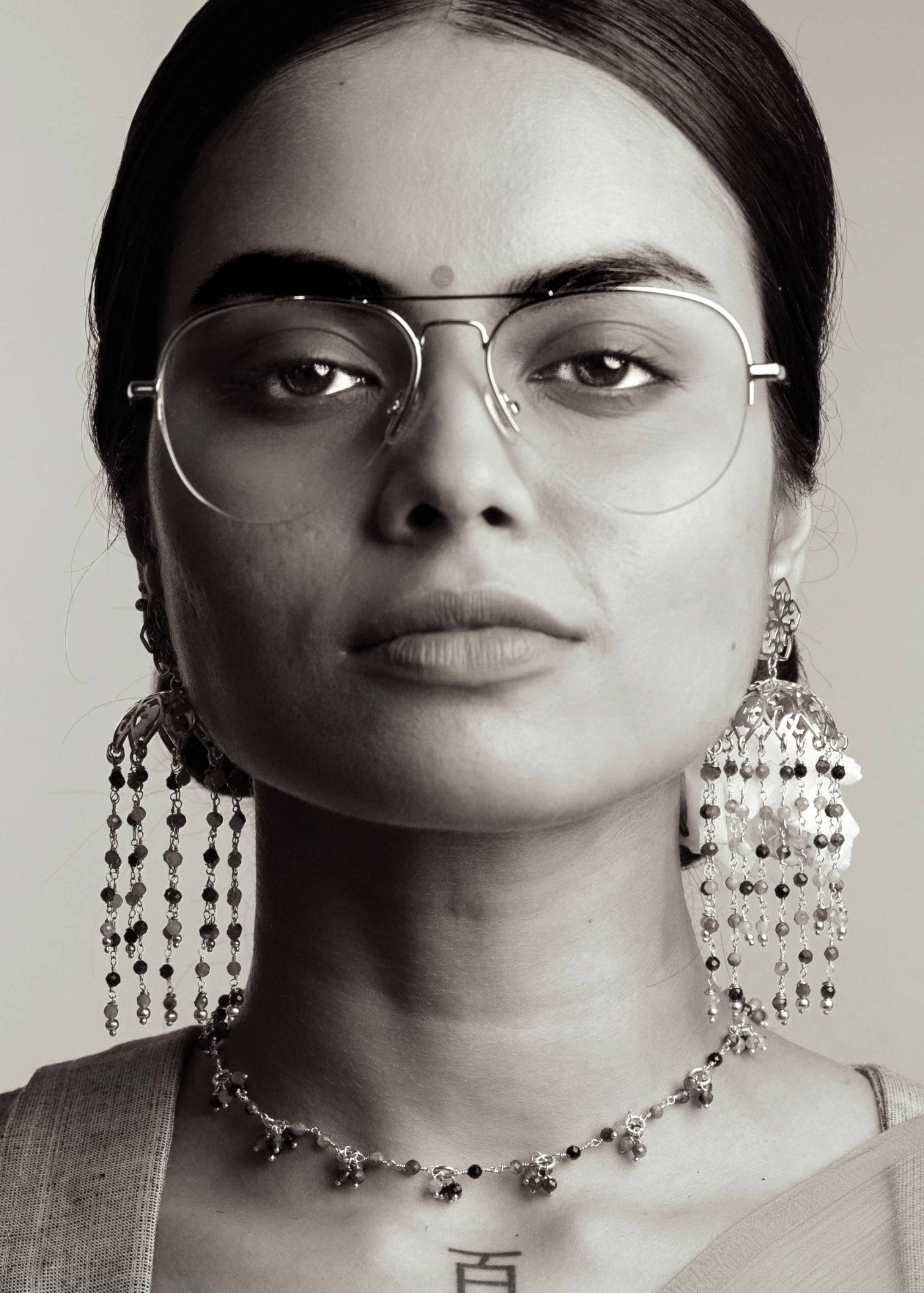 designer jhumka earrings by eina ahluwalia with multi coloured tourmalines for weddings and occasions