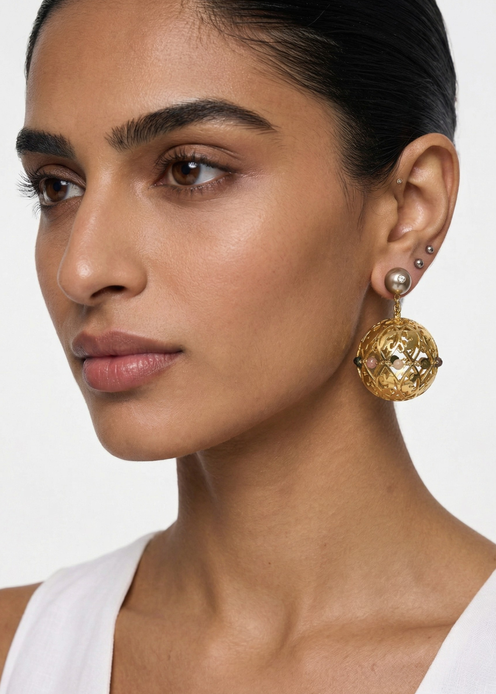 lightweight 3-dimensional ball earrings with a detachable, accented champagne pearl stud accented with 10 multi-coloured Tourmalines