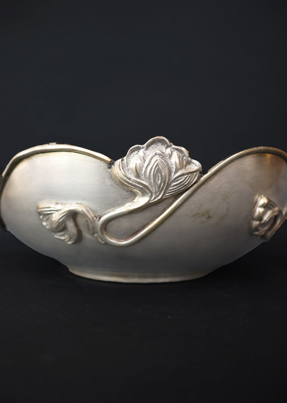 Beautiful silver-plated Art Nouveau bowl decorated with water lilies. The curvaceous floral and vine are cast and applied on the scalloped rim and sides of the bow and are classic art nouveau. This is a perfect fruit bowl or center piece. Made in France, early 1900s.