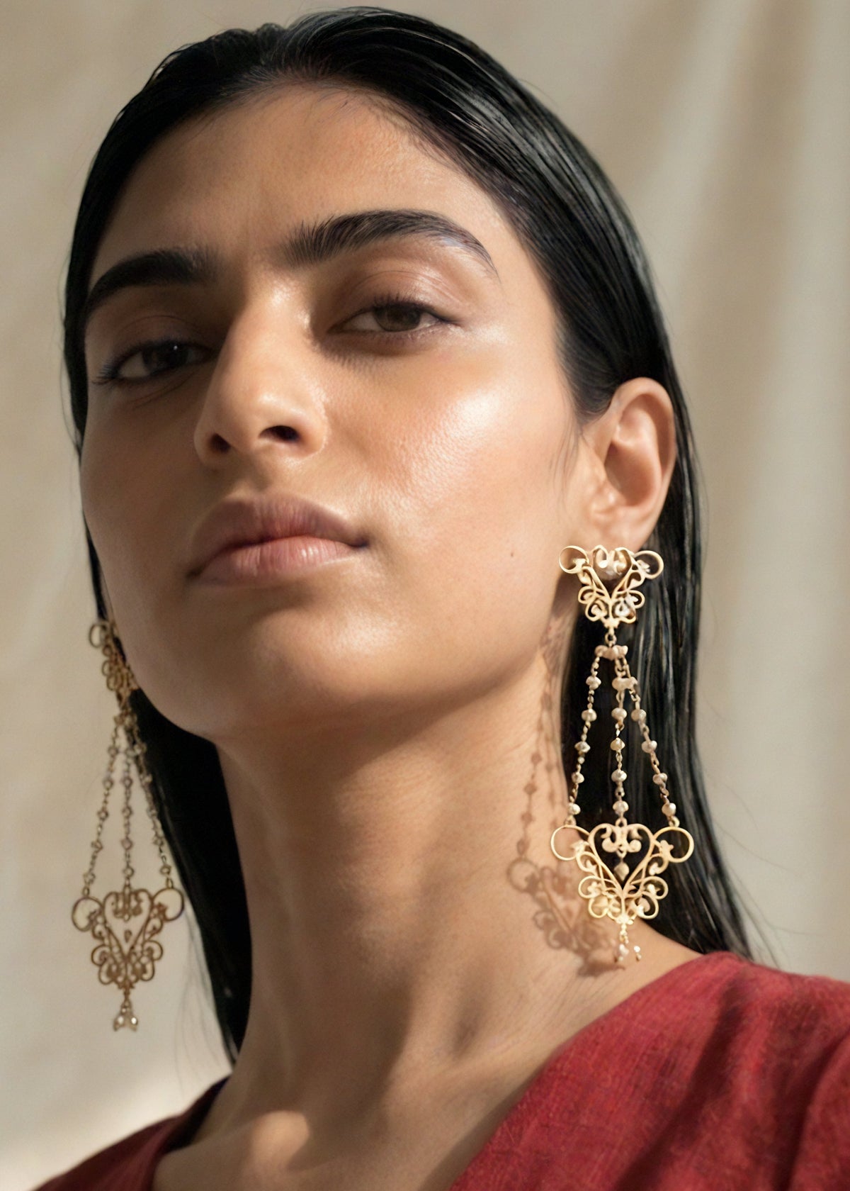 womb motif chandelier earrings with pearls by indian designer jewellery artist eina ahluwalia