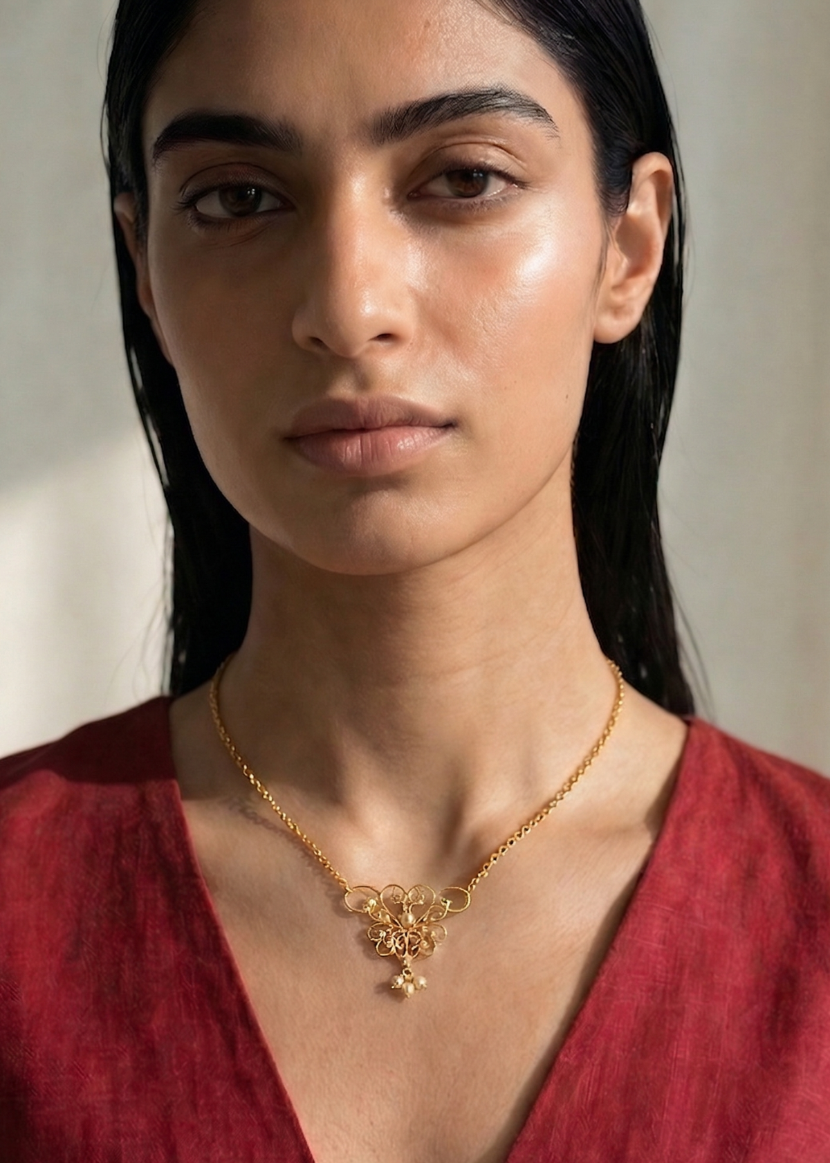 womb motif gold plated sterling silver necklace by indian jewellery designer eina ahluwalia