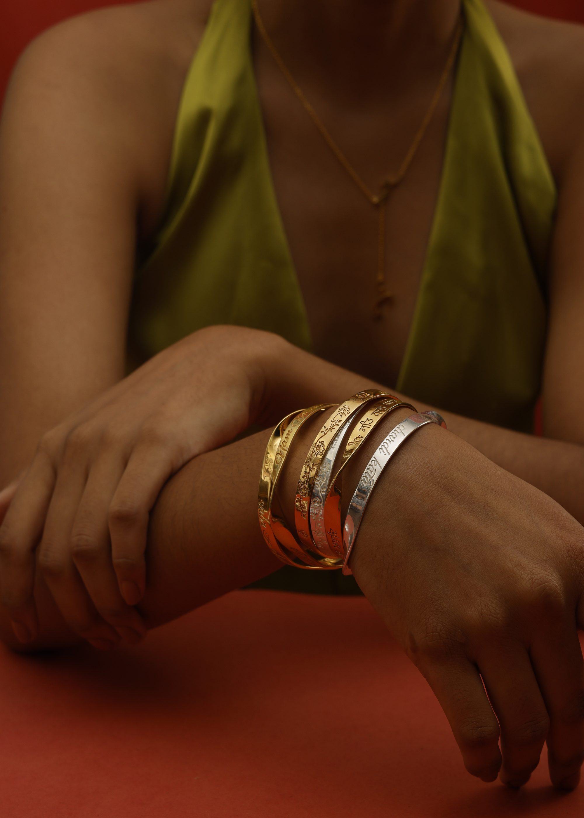 Engraved Mantra Bangle in sterling silver and 18k gold by Indian Designer Jewellery Artist Eina Ahluwalia
