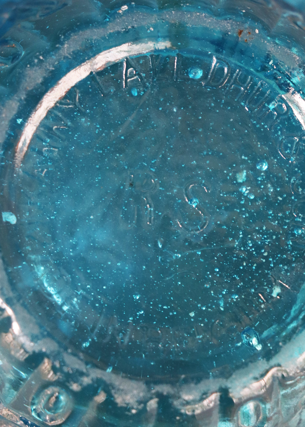  Antique moulded glass bowl in a beautiful turquoise colour and an incredible history