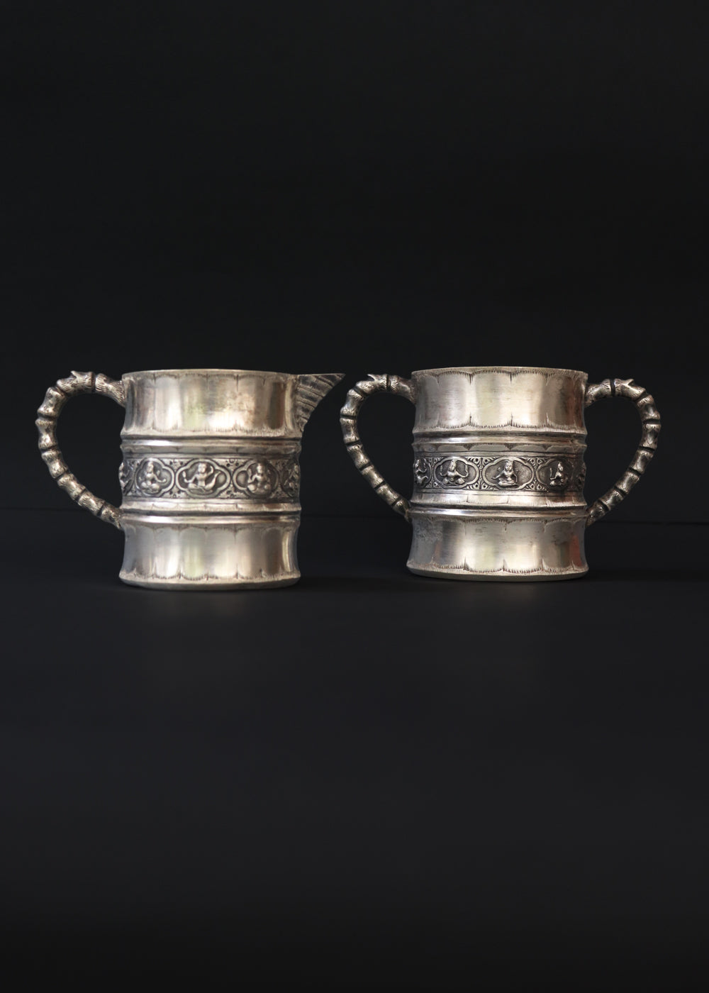 Antique silver plated “Swami” style milk pot and sugar bowl in the style of P.Orr and sons, the important silversmith firm in Colonial South India. They depict seated divine figures.