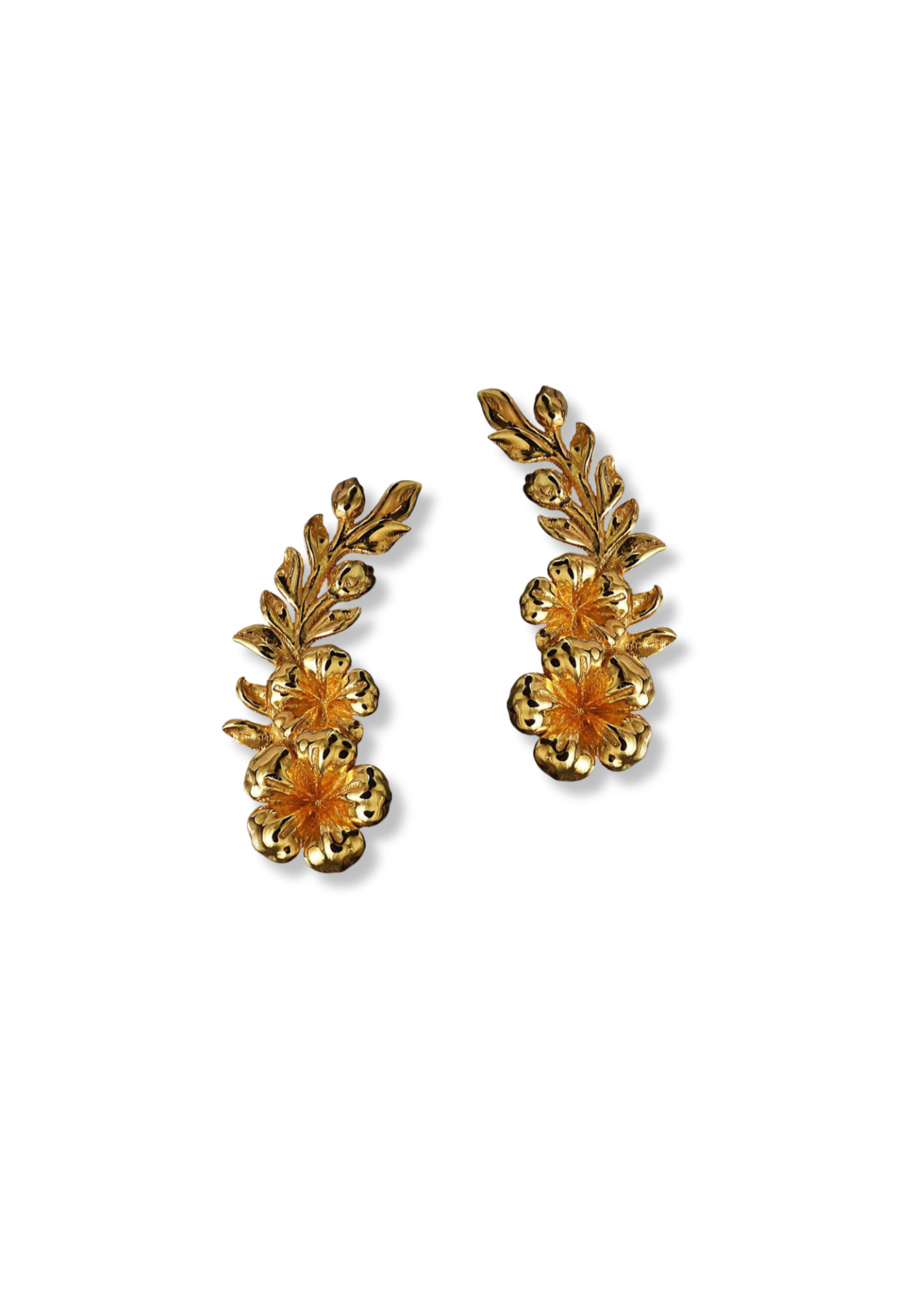 A pair of gold-toned floral stud earrings with leafy sprigs and small flower details, shown on a plain white background.