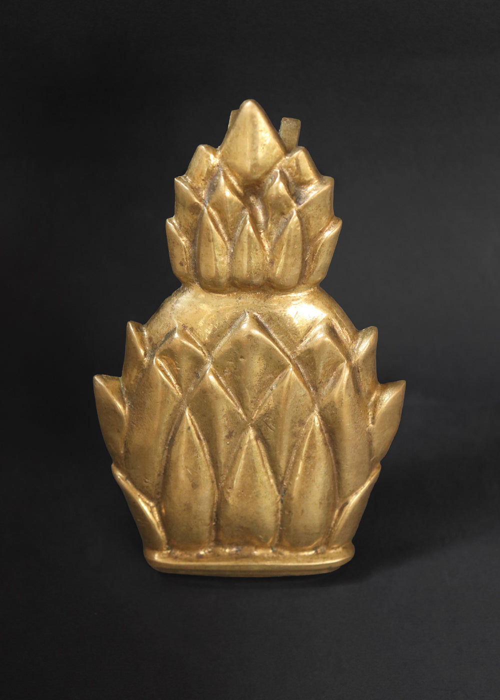 Vintage Newport brass door knocker. It is solid and heavy and was made by Virginia Metal crafters for their very popular Newport line. The pineapple knocker was especially beloved because the fruit is an enduring symbol of hospitality, wealth, and a safe return from sea voyages, a tradition with deep roots in Newport's maritime history. Made in the US, 1960s.