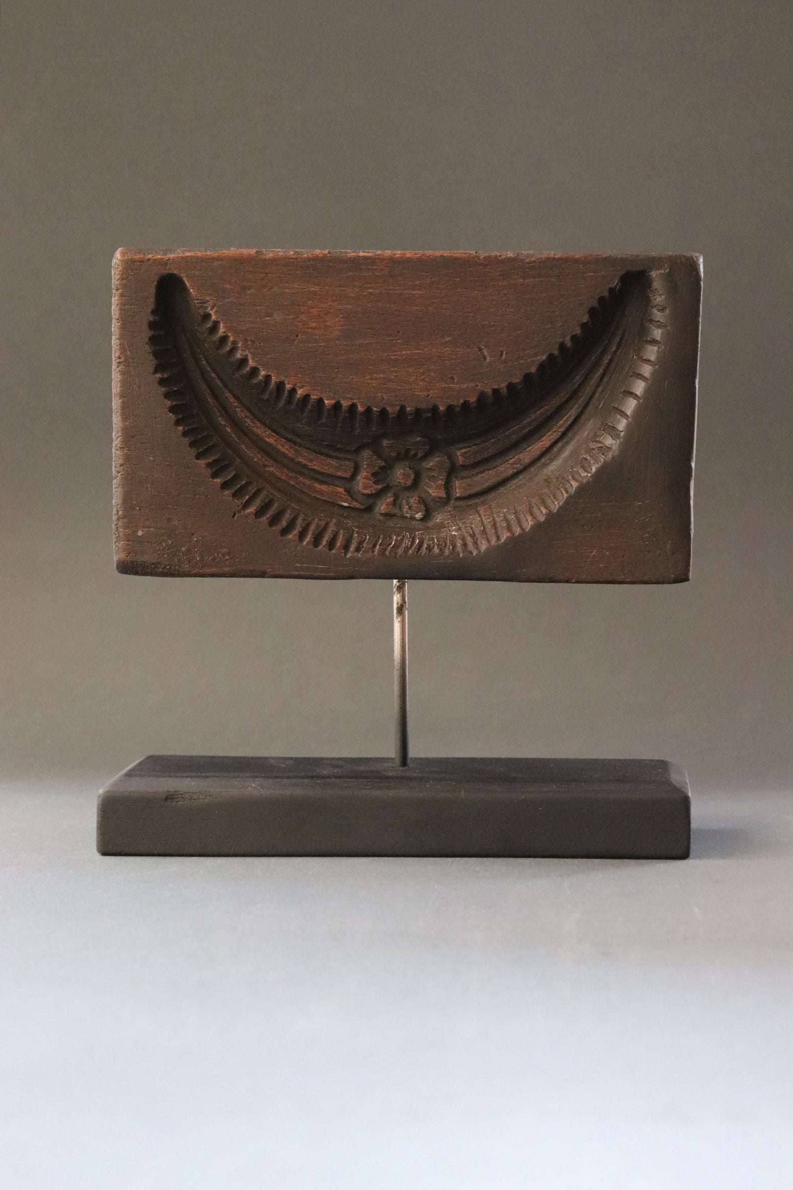 Plaque with deep relief of Shiva’s crescent moon carved in jackfruit tree wood. The crescent worn by Lord Shiva the moon in its fifth day phase and symbolizes the cycle of time through which the process of creation evolves, the beginning till the end. From Kerela, should be early 1900s.
