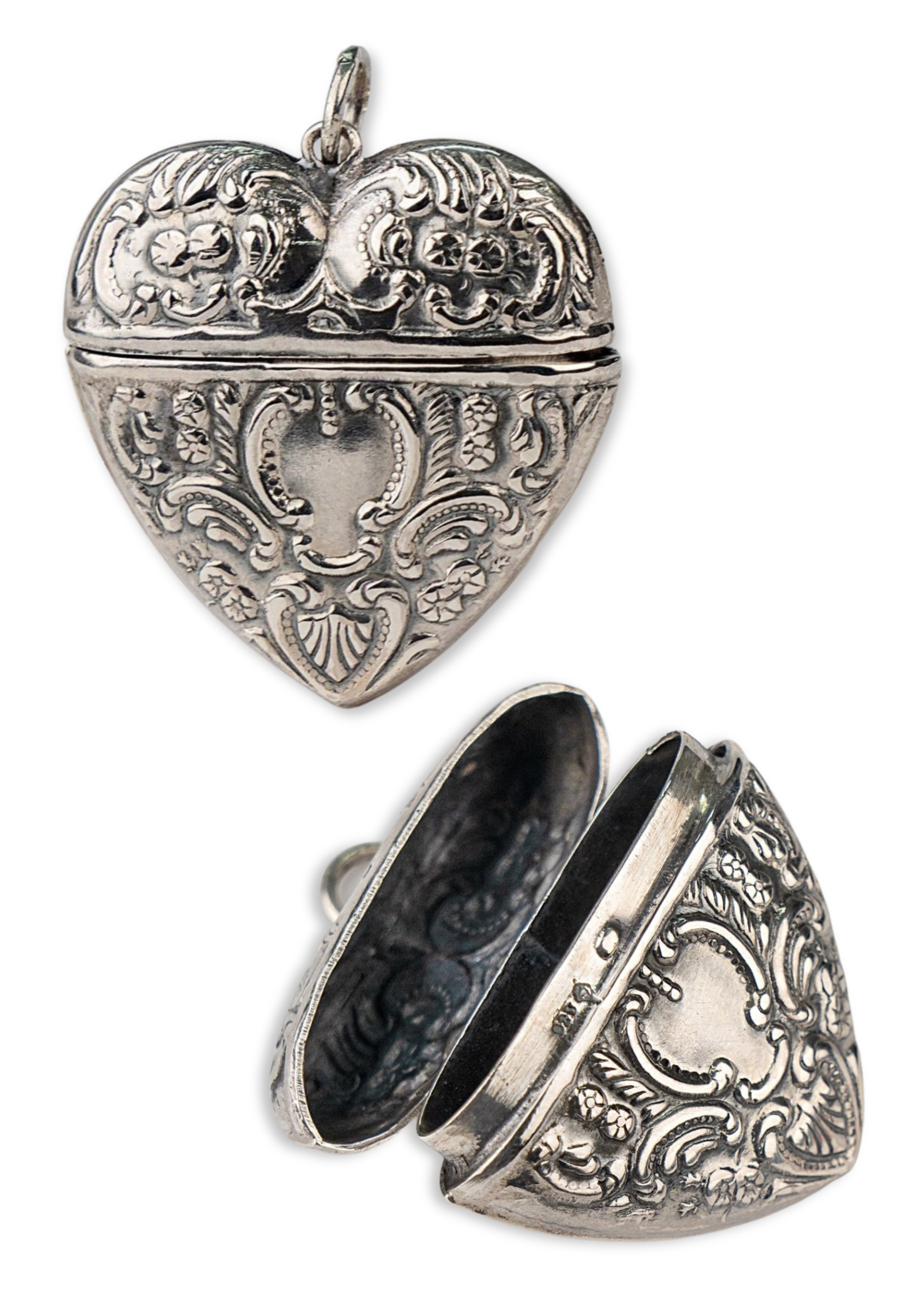 Victorian Engraved Heart Locket Pendant with floral motif - Openable and crafted in sterling silver. Store something precious inside this locket and take it with your wherever you go. Delivered globally.