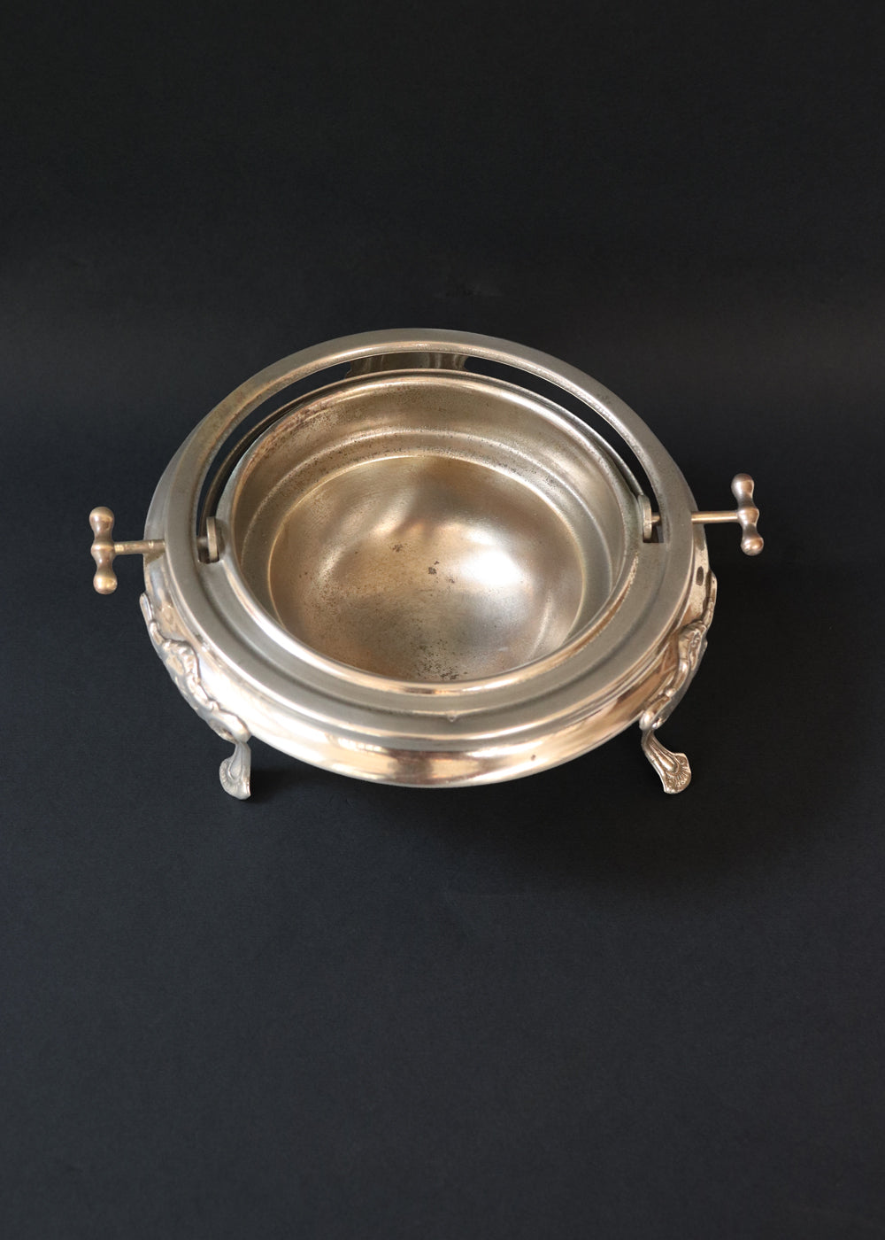 Vintage silver plated roll top caviar server or butter dish. It has a perfect dome top and clean lines and stands on 3 gorgeous feet decorated feet. Most likely mid 1900s, England.