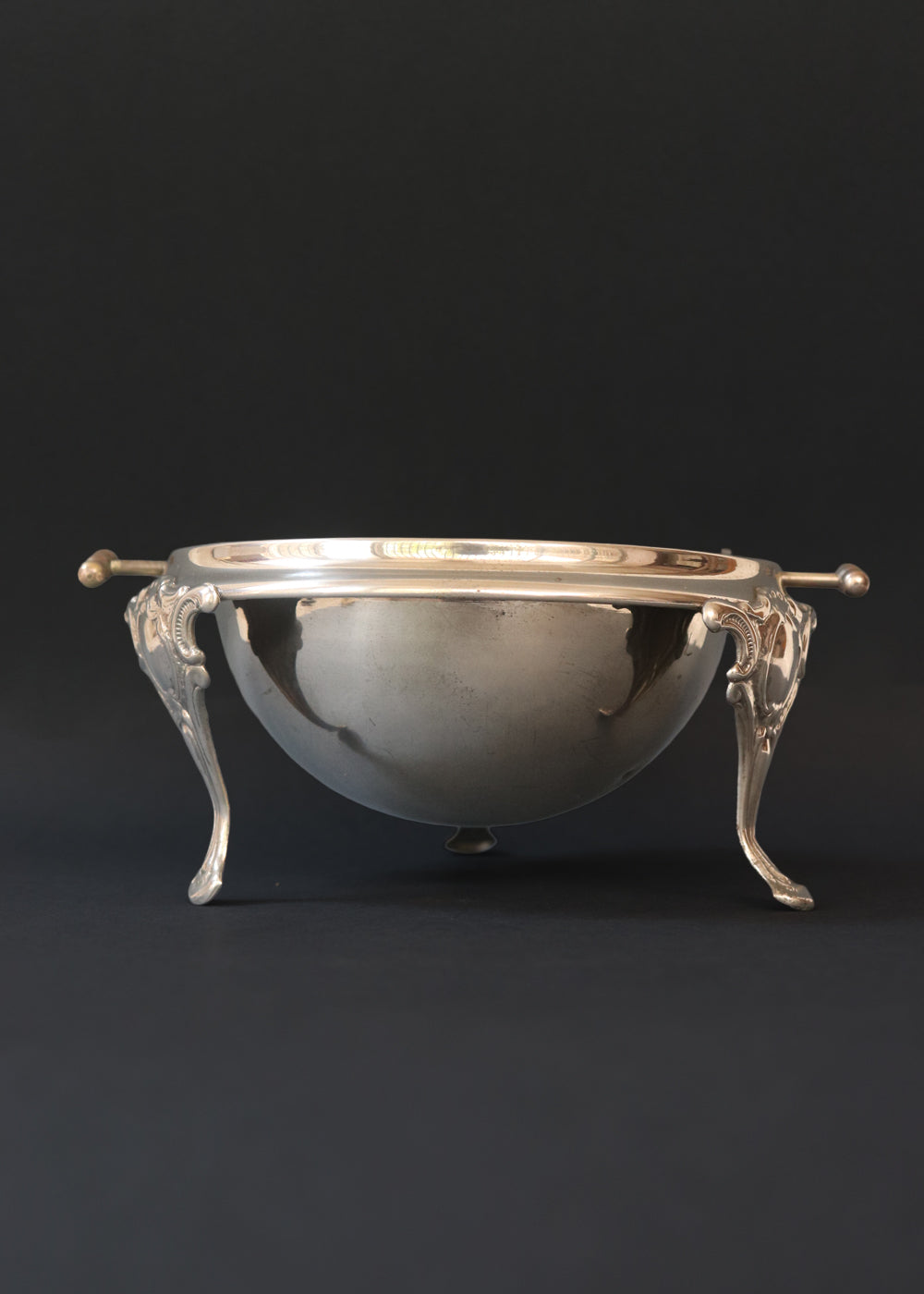 Vintage silver plated roll top caviar server or butter dish. It has a perfect dome top and clean lines and stands on 3 gorgeous feet decorated feet. Most likely mid 1900s, England.