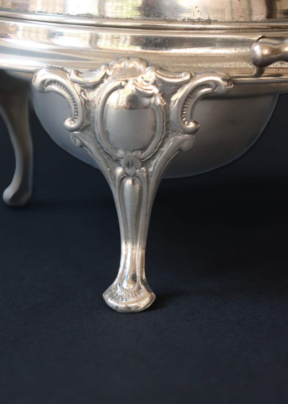 Vintage silver plated roll top caviar server or butter dish. It has a perfect dome top and clean lines and stands on 3 gorgeous feet decorated feet. Most likely mid 1900s, England.