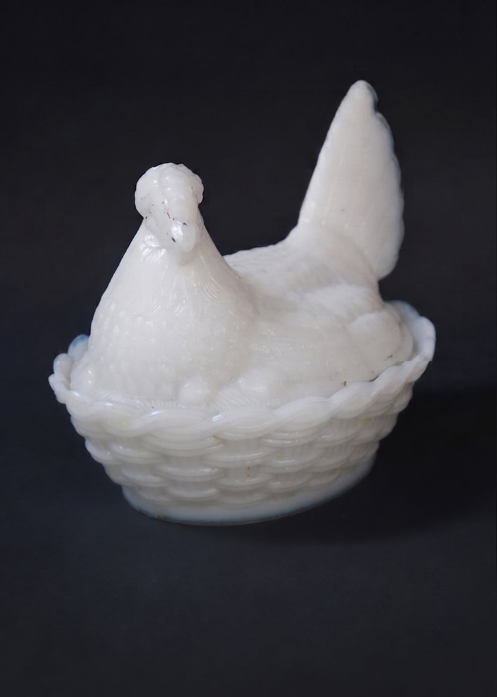 Antique opaline milk glass Hen on Nest covered dish. It was made by the prestigious French company Portieux Vallerysthal, and the company designed these between 1870 to 1920 so this piece is anywhere from 106 to 156 years old! The entire piece is very realistic with the feathers on the hen and the basket weave detail on nest, and the white colour is more rare than the others. Made in France.