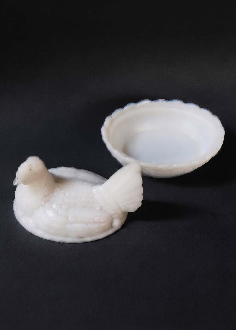 Antique opaline milk glass Hen on Nest covered dish. It was made by the prestigious French company Portieux Vallerysthal, and the company designed these between 1870 to 1920 so this piece is anywhere from 106 to 156 years old! The entire piece is very realistic with the feathers on the hen and the basket weave detail on nest, and the white colour is more rare than the others. Made in France.