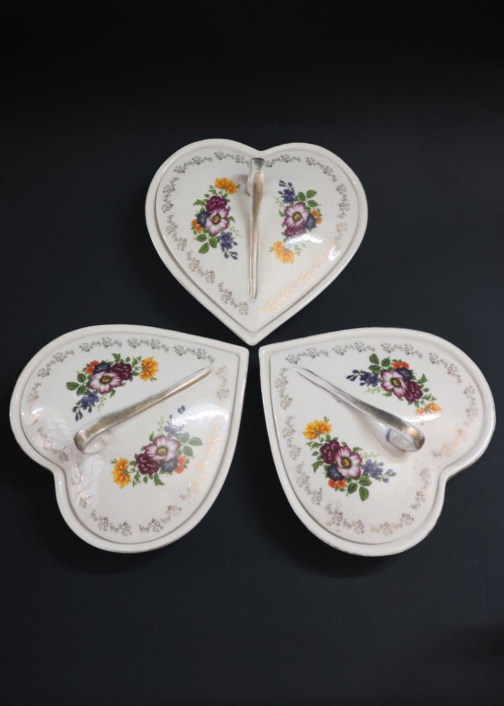 Vintage French Hors D'oeuvre set ornamented with beautiful floral bouquets and rimmed with gilted floral borders. These are by Hallimax, a French brand that distributed high-quality, romantic-style porcelain.