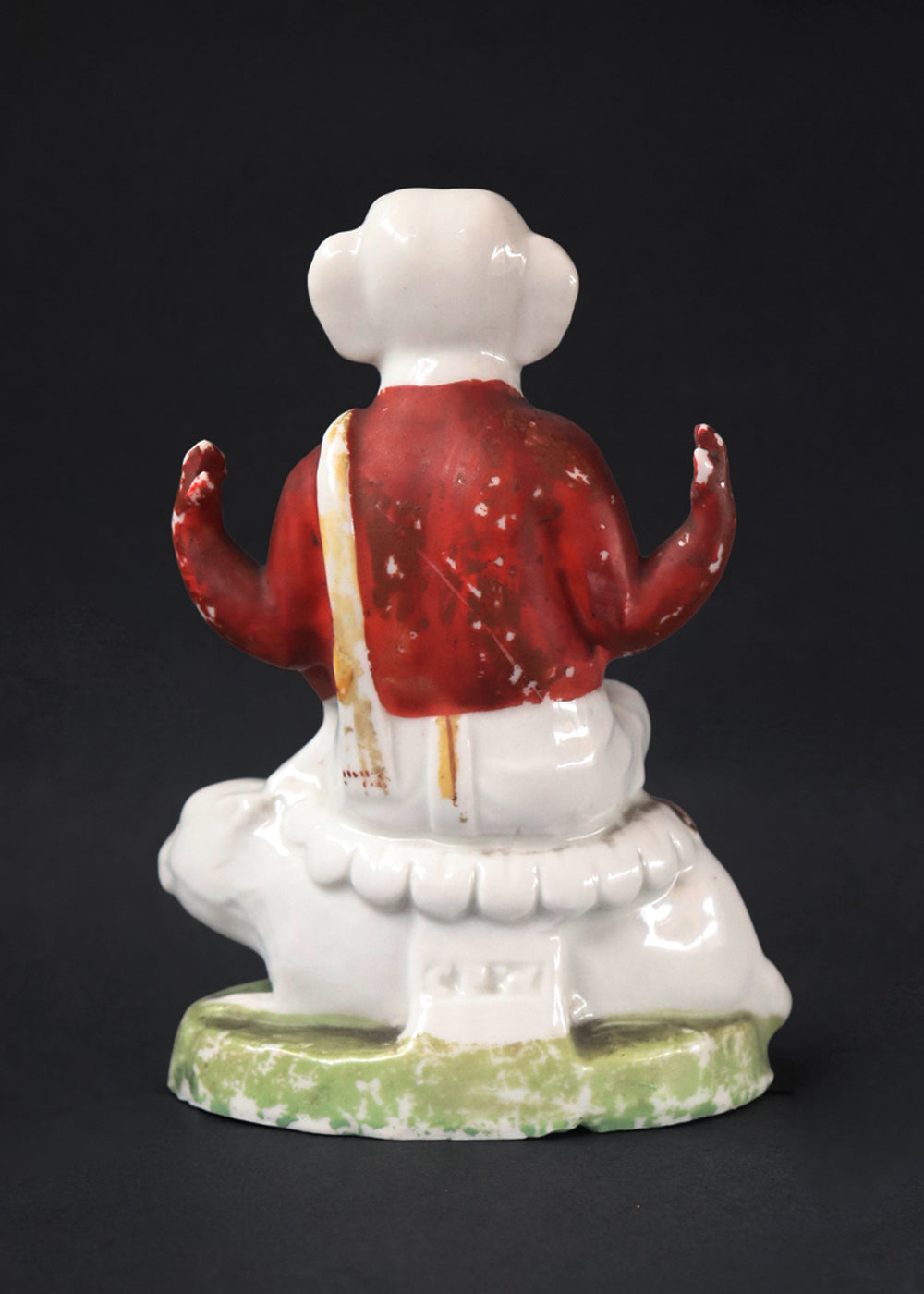 German made bisque porcelain slip cast figure of Ganesh made for colonial India in the early 1900s. These figures were inspired by paintings by Raja Ravi Varma.