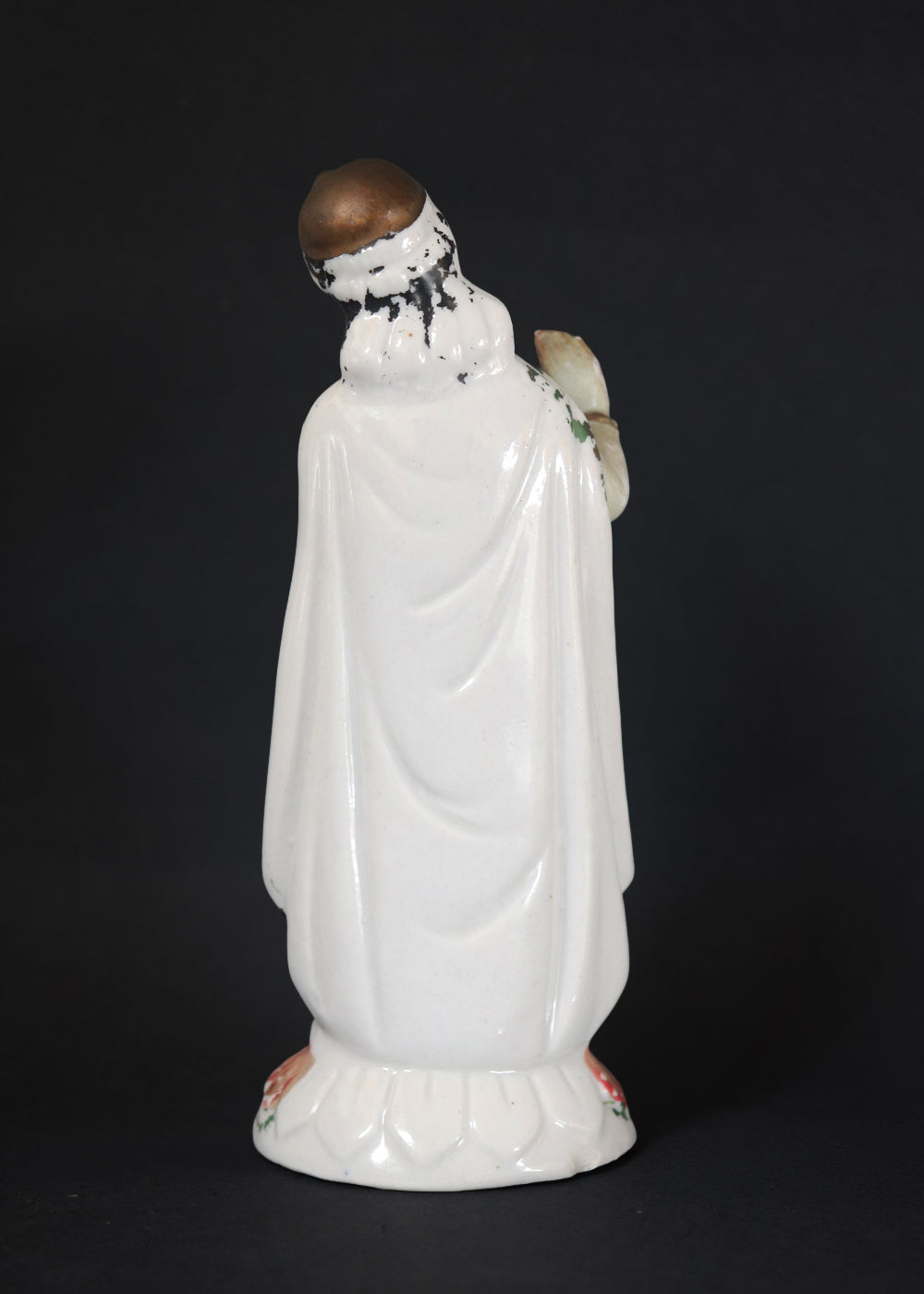 German made porcelain slip cast figure of Lord Krishna made for colonial India in the early 1900s. These figures were inspired by paintings by Raja Ravi Varma.