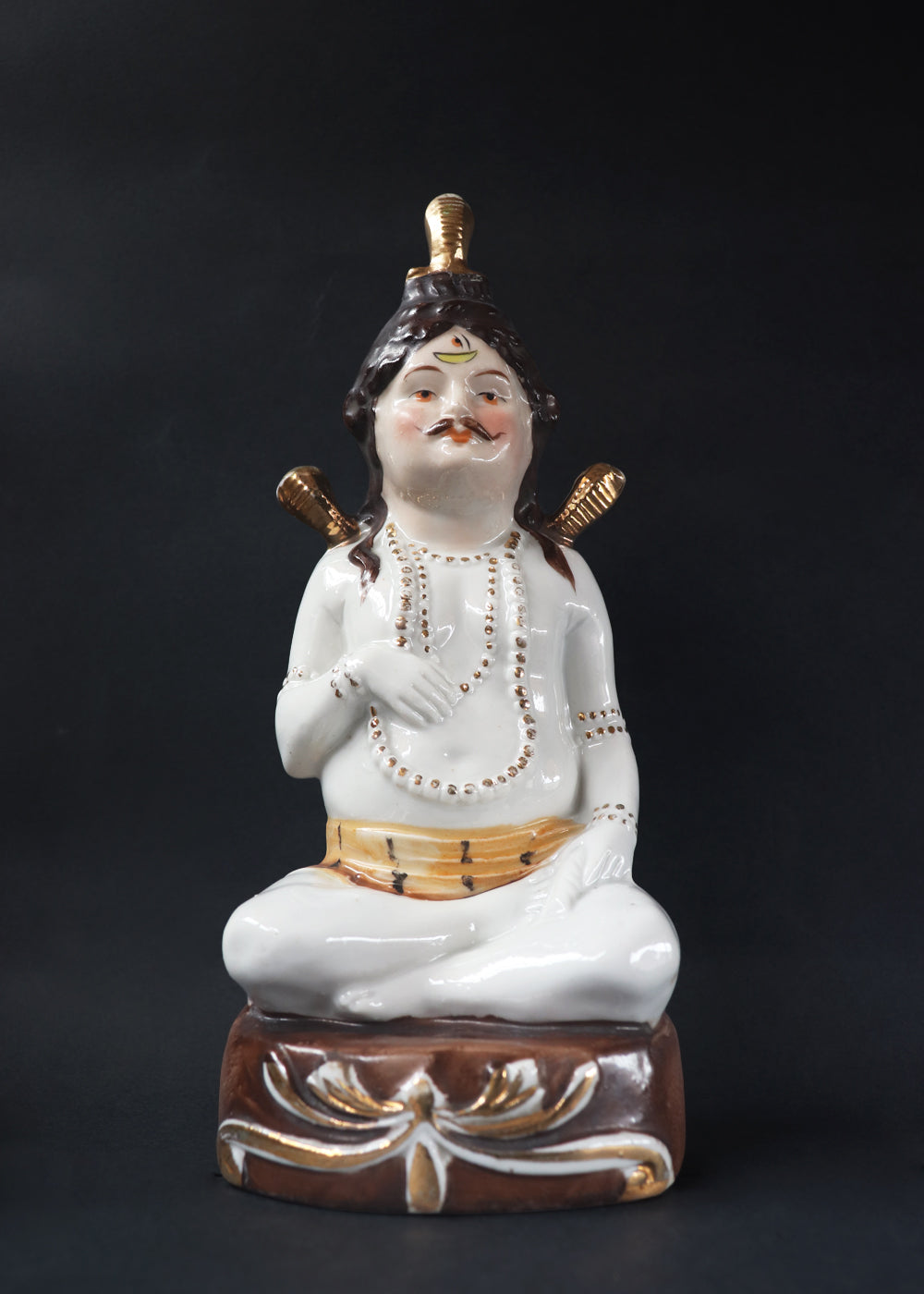 German made porcelain slip cast figure of Lord Shiva made for colonial India in the early 1900s. These figures were inspired by paintings by Raja Ravi Varma.