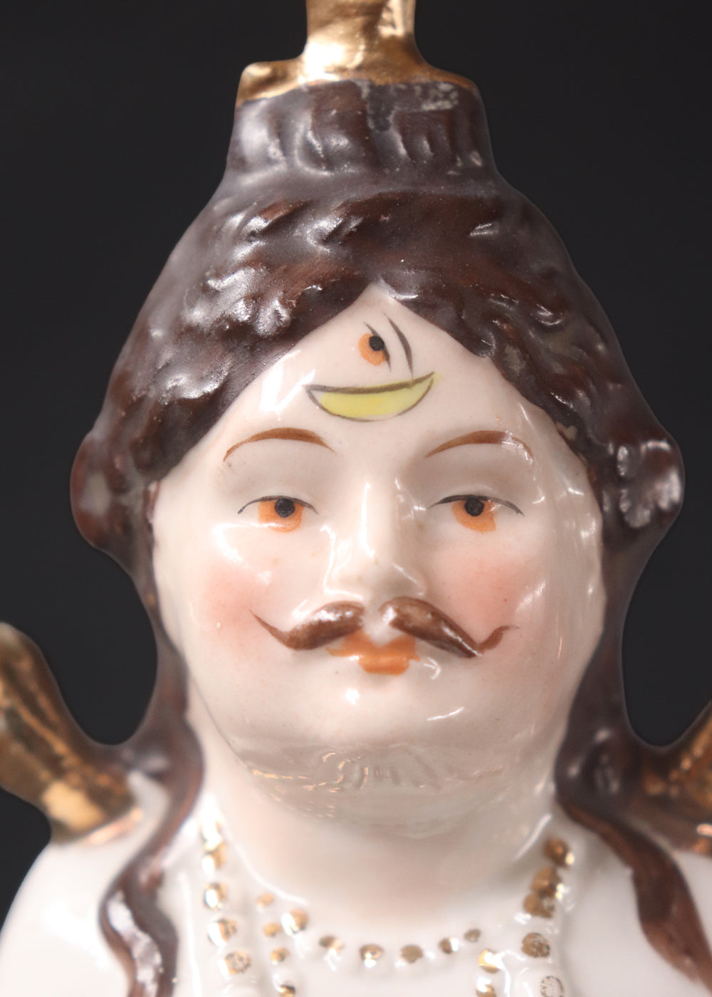German made porcelain slip cast figure of Lord Shiva made for colonial India in the early 1900s. These figures were inspired by paintings by Raja Ravi Varma.