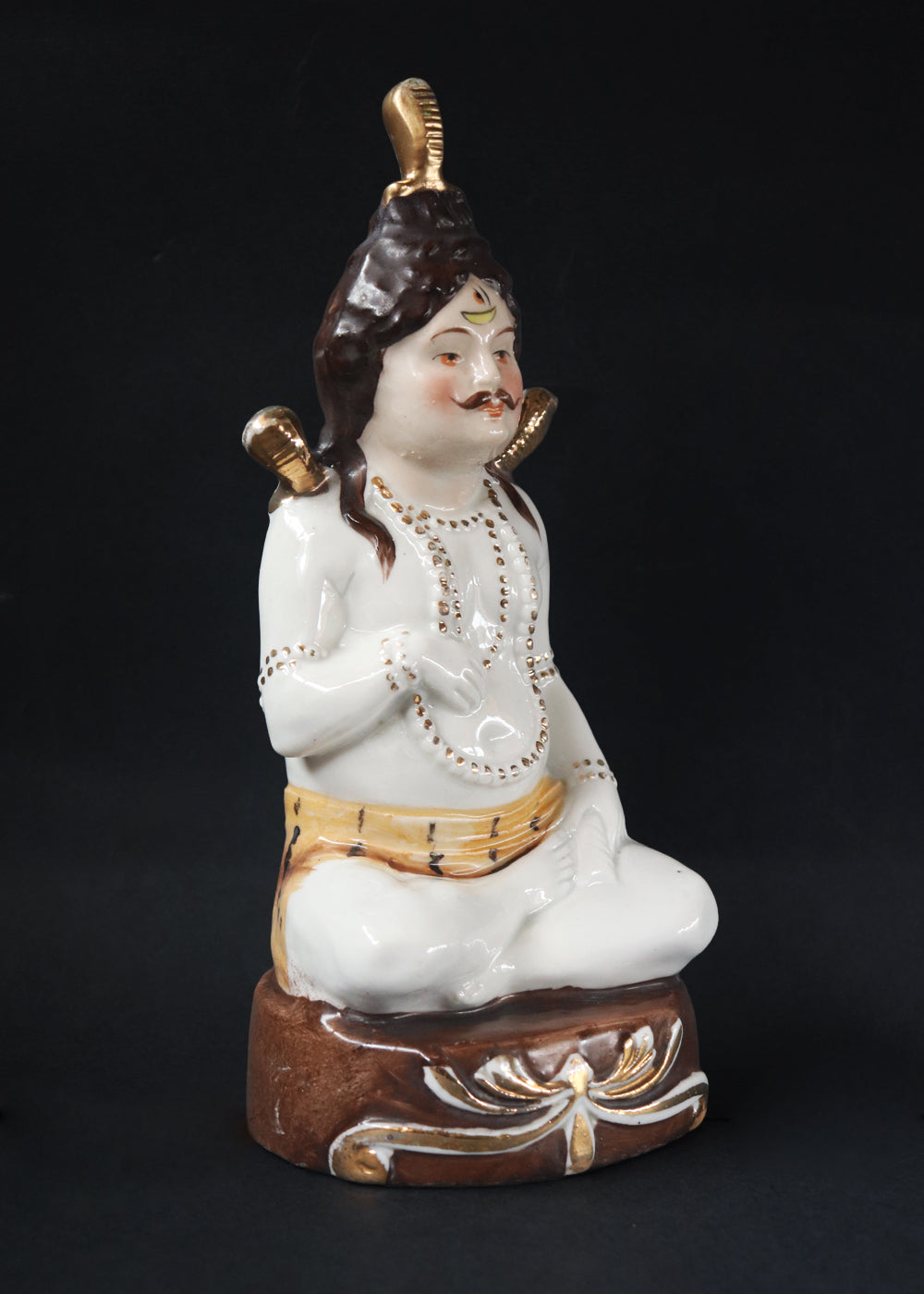 German made porcelain slip cast figure of Lord Shiva made for colonial India in the early 1900s. These figures were inspired by paintings by Raja Ravi Varma.