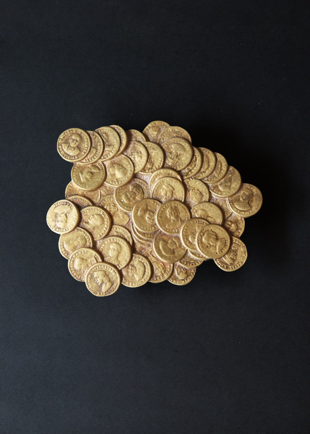 Vintage brass “Pile-O-Gold" with coins featuring faces of historical figures