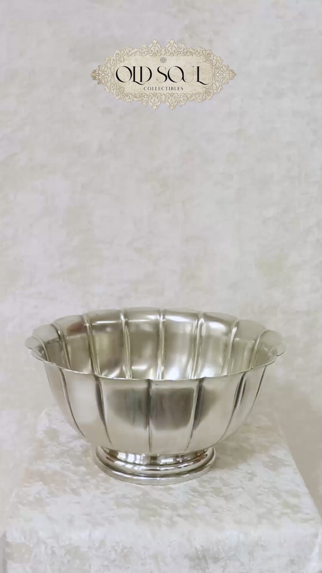 Vintage silver plated Rose Bowl with a classic lobed body and a scalloped undulating rim. The panels sweep upward to form an elegant petaled shape and it is raised on a stepped round pedestal base. It has the markings Sheffield England and a brand name that’s hard to read on the base. It would make a gorgeous centrepiece on dining or console table. Should be from the mid 1900s, England.