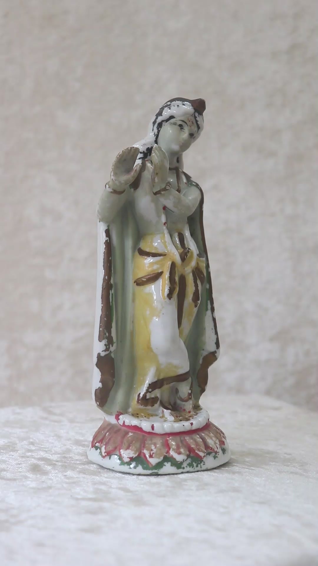 German made porcelain slip cast figure of Lord Krishna made for colonial India in the early 1900s. These figures were inspired by paintings by Raja Ravi Varma.