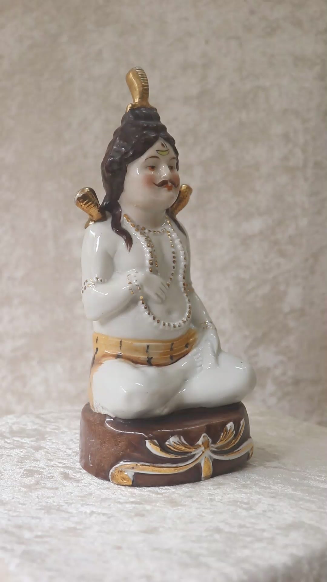 German made porcelain slip cast figure of Lord Shiva made for colonial India in the early 1900s. These figures were inspired by paintings by Raja Ravi Varma.