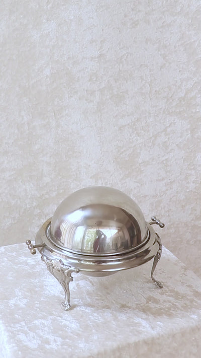 Vintage silver plated roll top caviar server or butter dish. It has a perfect dome top and clean lines and stands on 3 gorgeous feet decorated feet. Most likely mid 1900s, England.