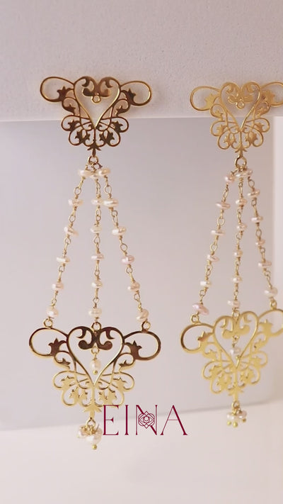 womb motif chandelier earrings with pearls by indian designer jewellery artist eina ahluwalia