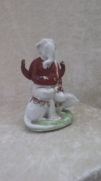 German made bisque porcelain slip cast figure of Ganesh made for colonial India in the early 1900s. These figures were inspired by paintings by Raja Ravi Varma.