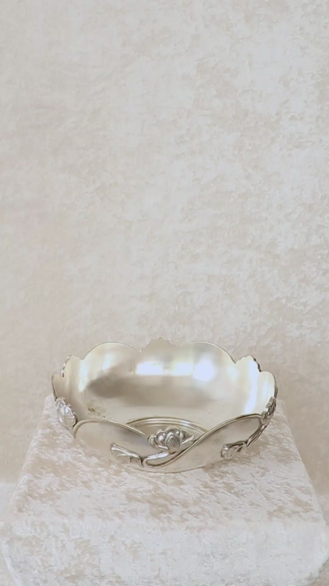 Beautiful silver-plated Art Nouveau bowl decorated with water lilies. The curvaceous floral and vine are cast and applied on the scalloped rim and sides of the bow and are classic art nouveau. This is a perfect fruit bowl or center piece. Made in France, early 1900s.