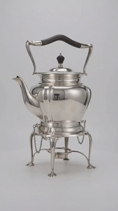 Antique Edwardian spirit kettle with its stand, burner and securing pins in superb condition. The kettle was made by Roberts & Belk in Sheffield with high-grade silver plate or” Regent Plate”, and the base has all the authenticating stamps including the registration number which was was officially issued by the British patient office in the year 1902, confirming that this kettle was made in England between 1902 and 1910.