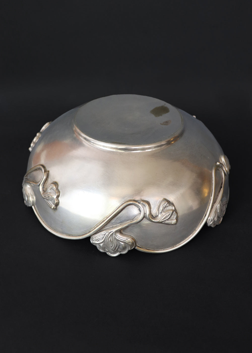 Beautiful silver-plated Art Nouveau bowl decorated with water lilies. The curvaceous floral and vine are cast and applied on the scalloped rim and sides of the bow and are classic art nouveau. This is a perfect fruit bowl or center piece. Made in France, early 1900s.