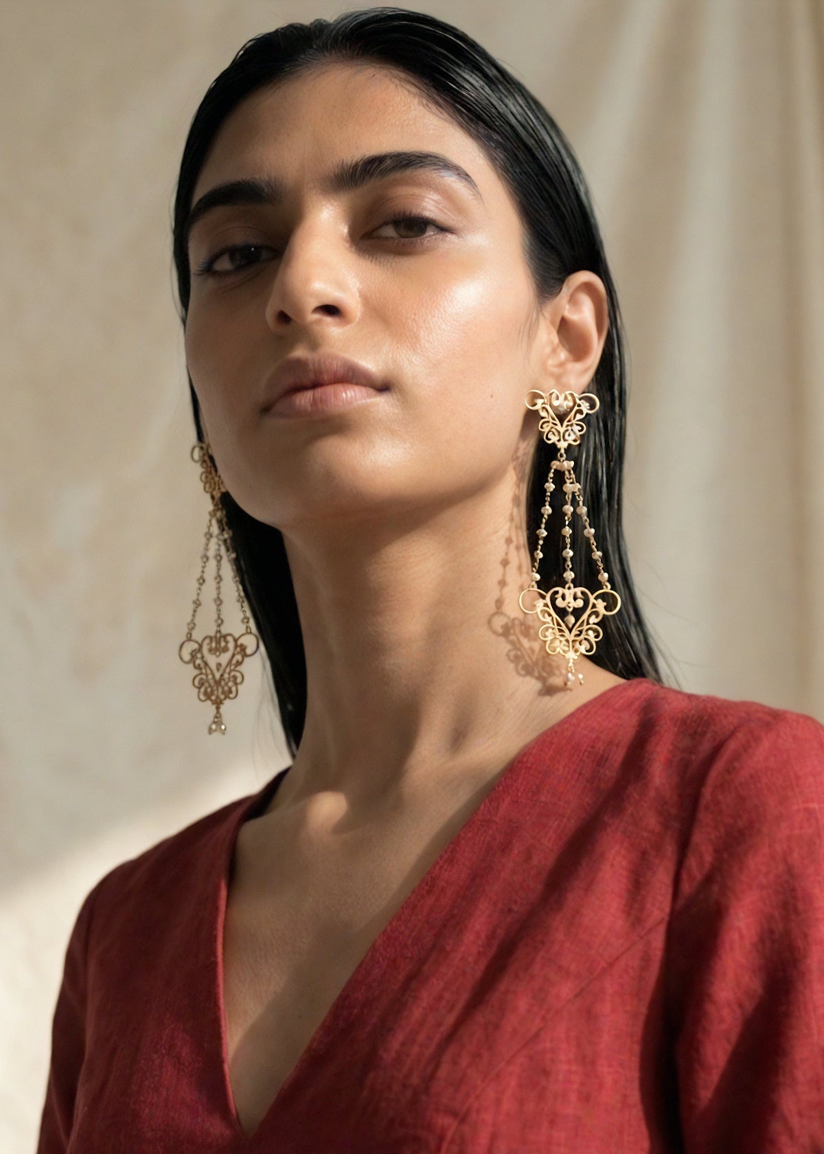 womb motif chandelier earrings with pearls by indian designer jewellery artist eina ahluwalia