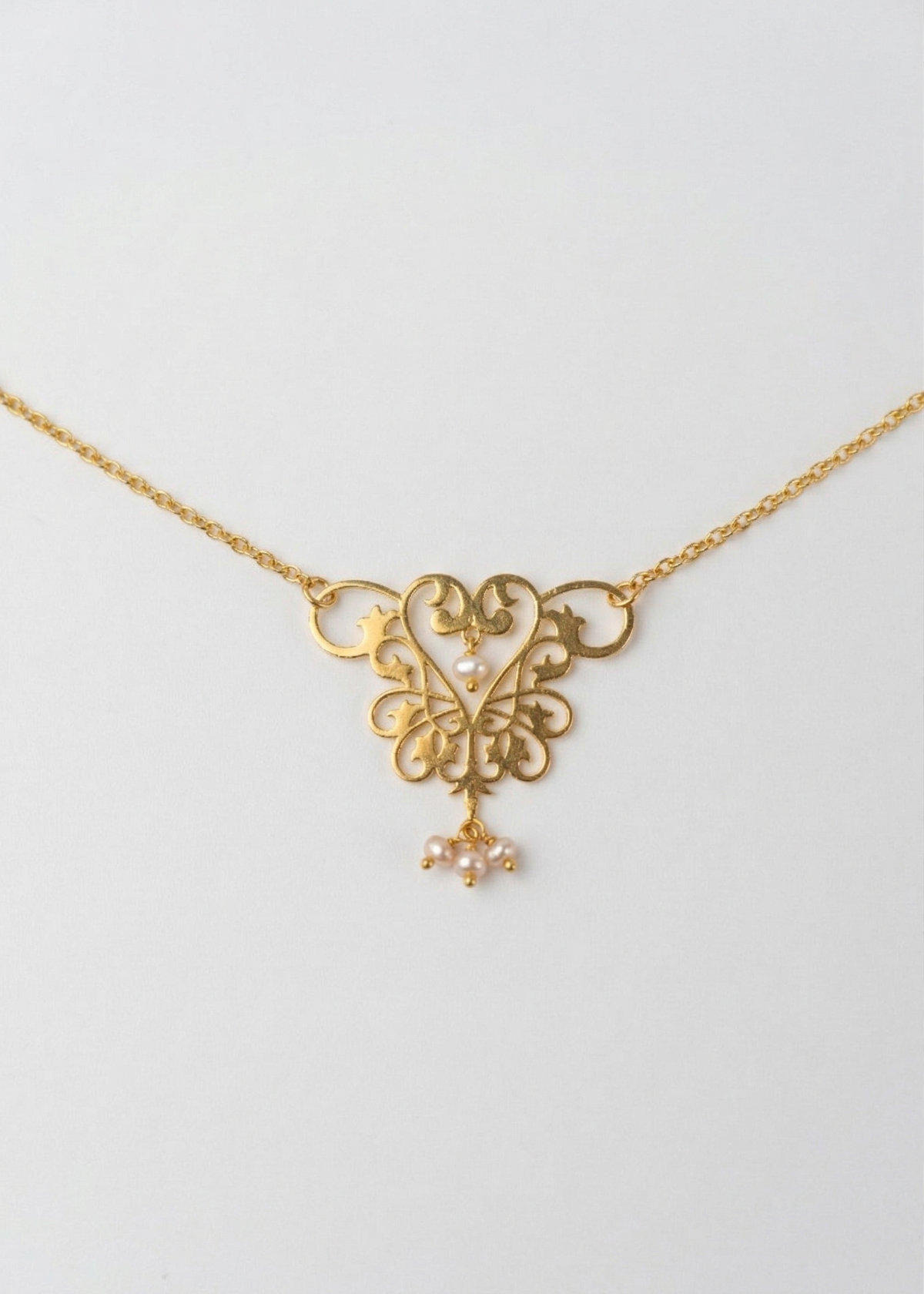 womb motif gold plated sterling silver necklace  by indian jewellery designer eina ahluwalia