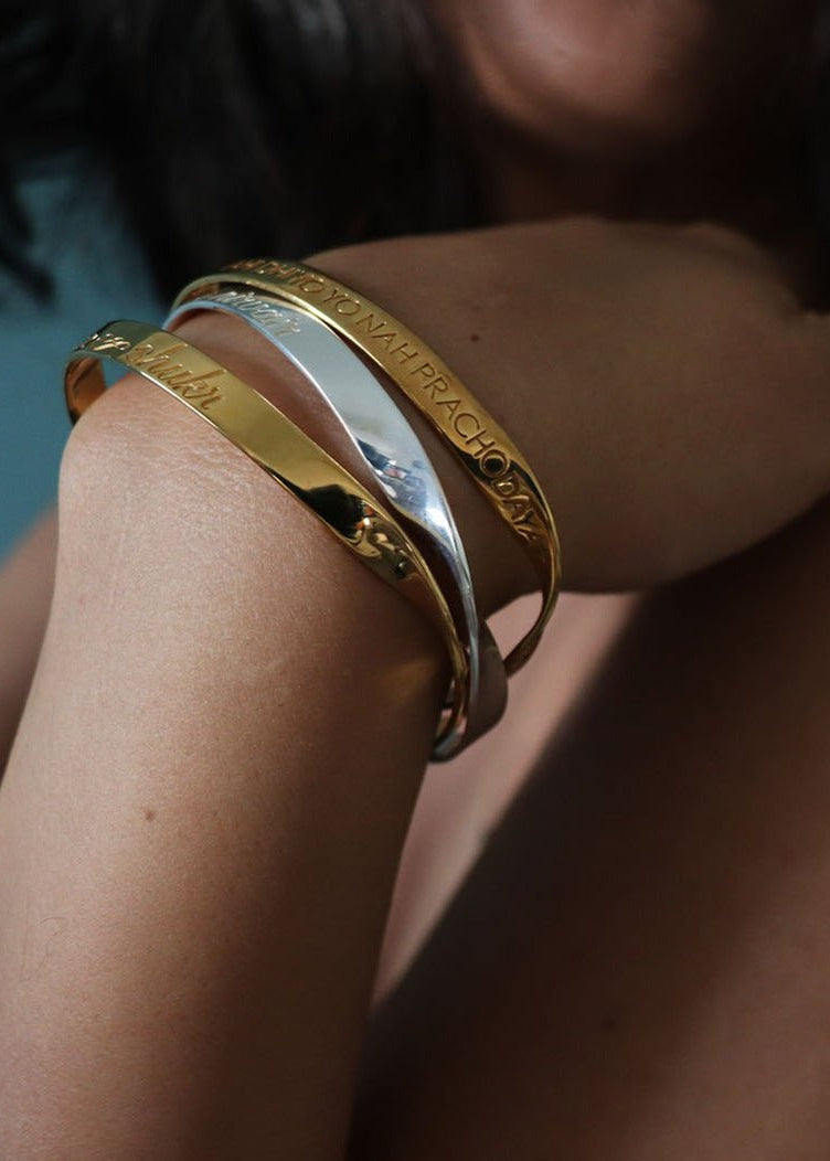 Custom Engraved Nam Myoho Renge Kyo Name Word Mantra Bangle in sterling silver and 18k gold by Indian Designer Jewellery Artist Eina Ahluwalia