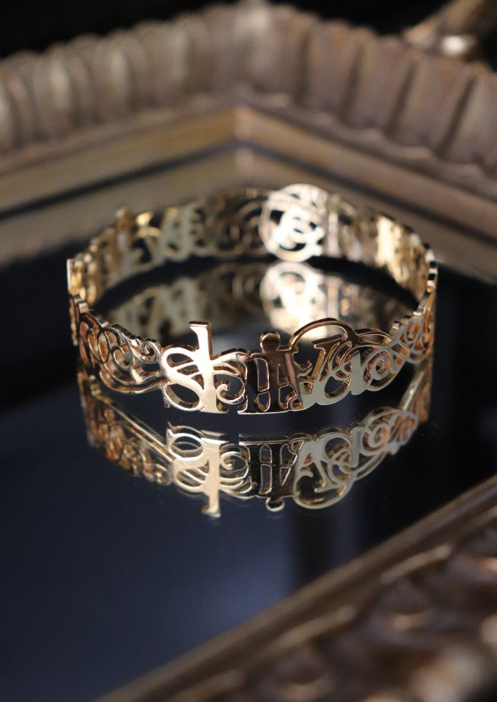 Custom Fretwork Filigree Name Word Mantra Bangle in sterling silver and 18k gold by Indian Designer Jewellery Artist Eina Ahluwalia